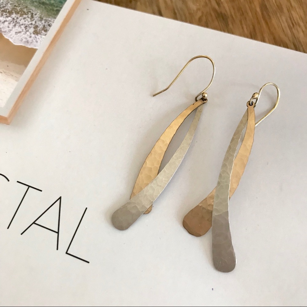 Hammered brass and silver drop earrings.